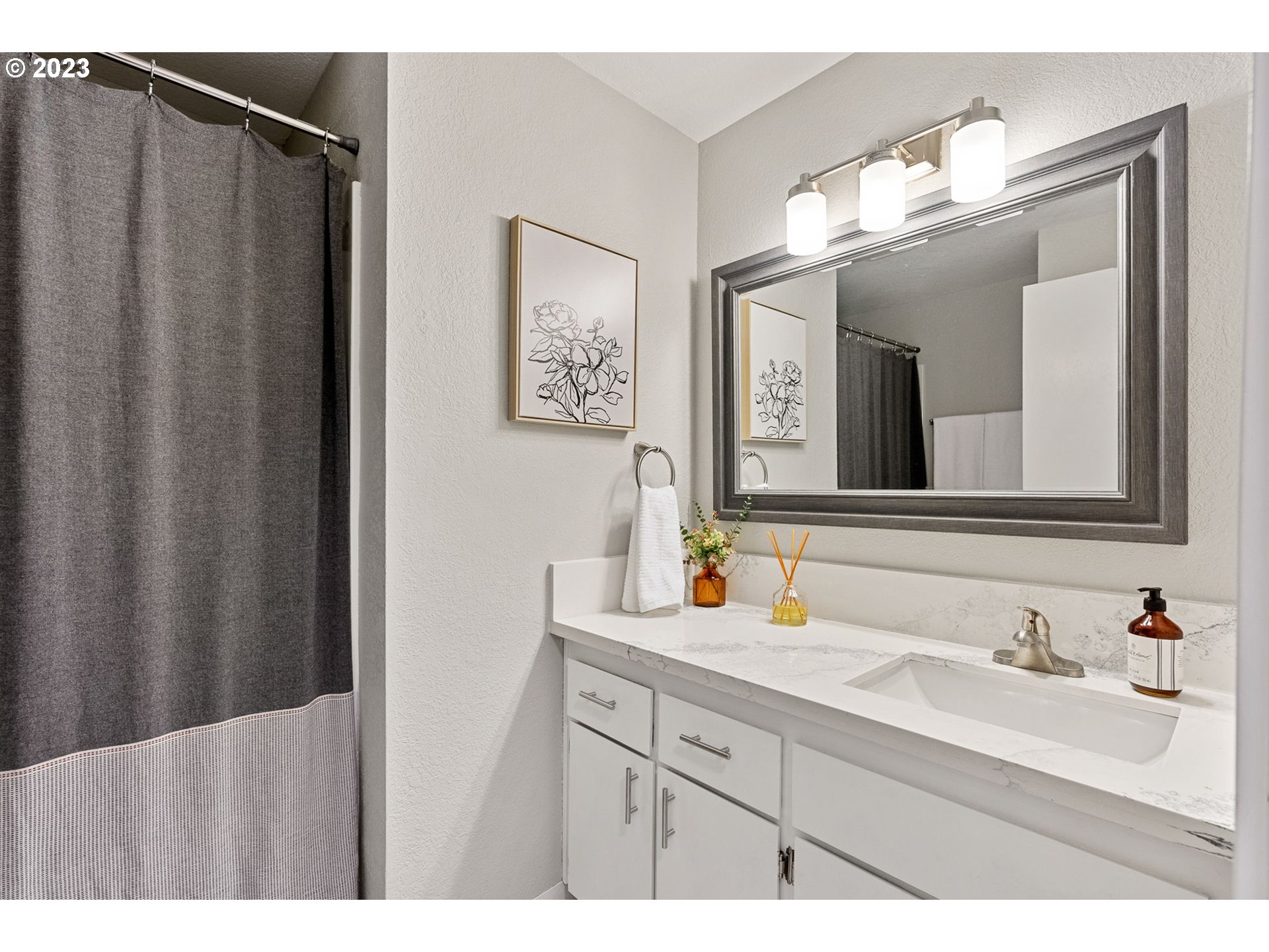 5830 Southwest 177th Avenue Beaverton, OR 97007 - Photo 28 of 41 a bathroom with a double vanity sink and a mirror
