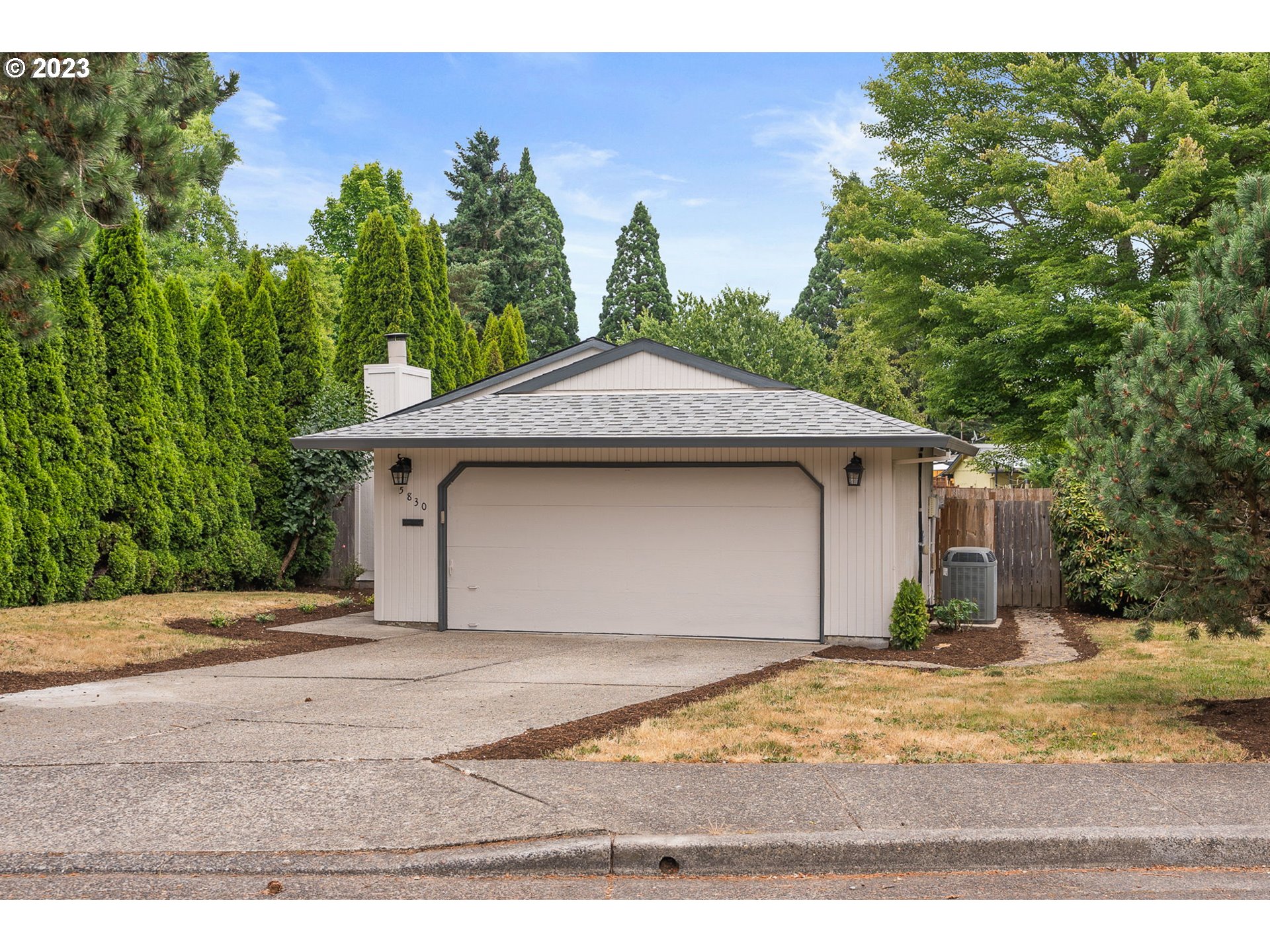 5830 Southwest 177th Avenue Beaverton, OR 97007 - Photo 3 of 41 a front view of a house with a yard and garage
