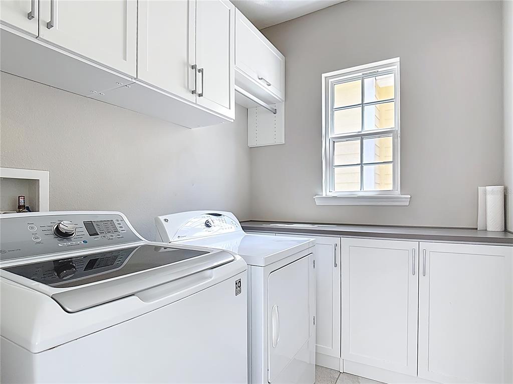 1513 Resolute Street Celebration, FL 34747 - Photo 39 of 43 a utility room with dryer and washer
