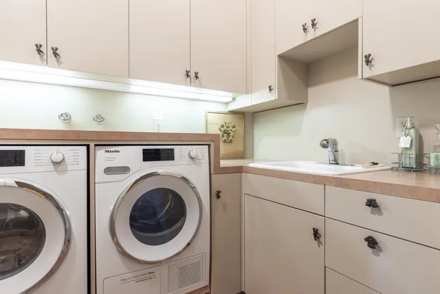 a utility room with dryer and washer