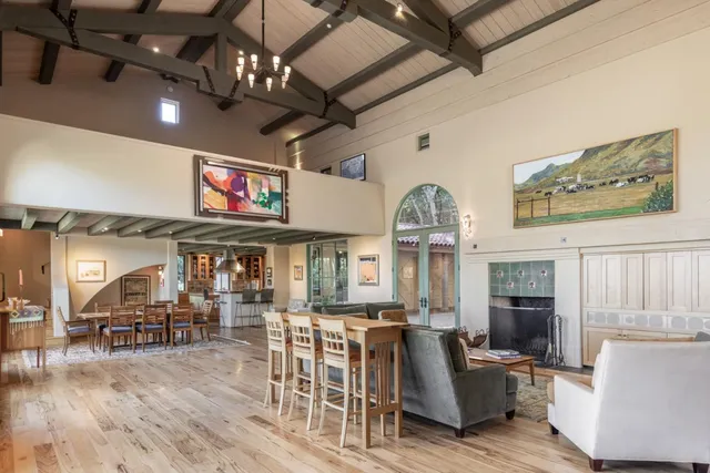 a view of a livingroom with furniture a flat screen tv and couches