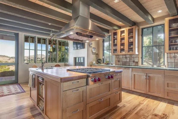 a kitchen with a stove and a sink