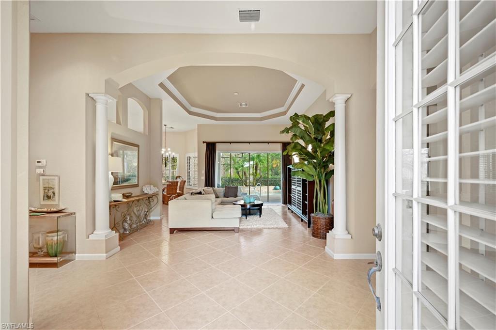 7950 Founders Circle Naples, FL 34104 - Photo 11 of 43 a living room with furniture and a large window