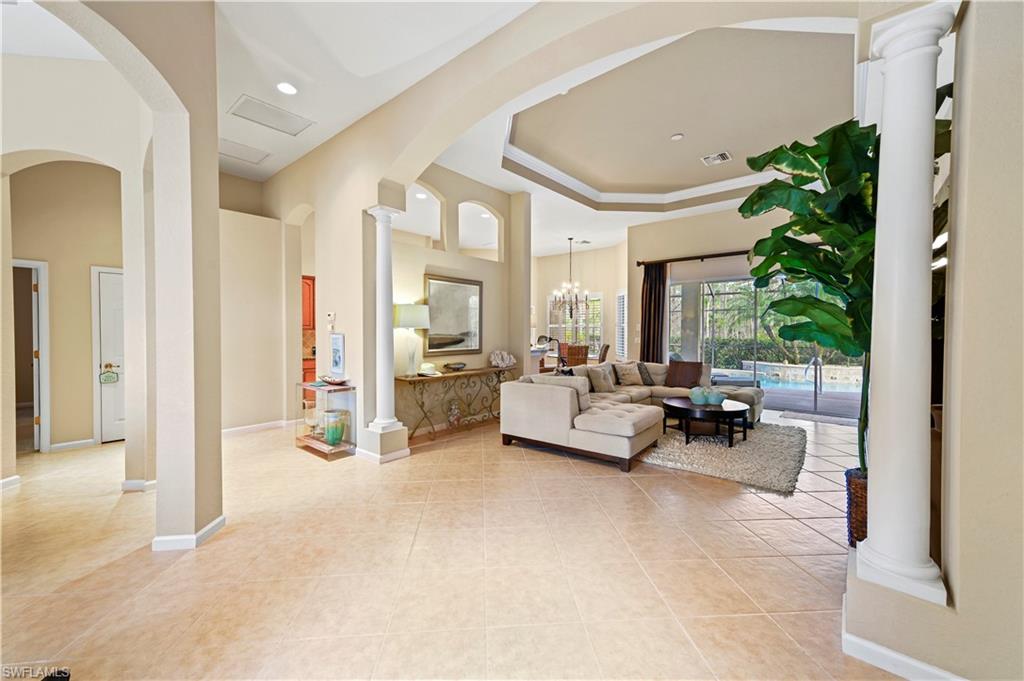 7950 Founders Circle Naples, FL 34104 - Photo 12 of 43 a living room with furniture and a large window