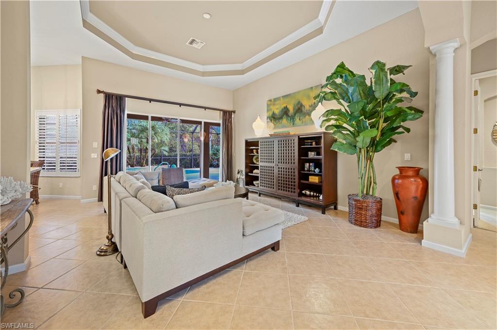 7950 Founders Circle Naples, FL 34104 - Photo 13 of 43 a living room with furniture and a potted plant
