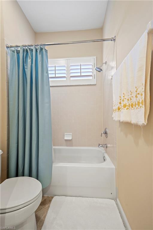 7950 Founders Circle Naples, FL 34104 - Photo 20 of 43 a bathroom with a toilet and a bathtub