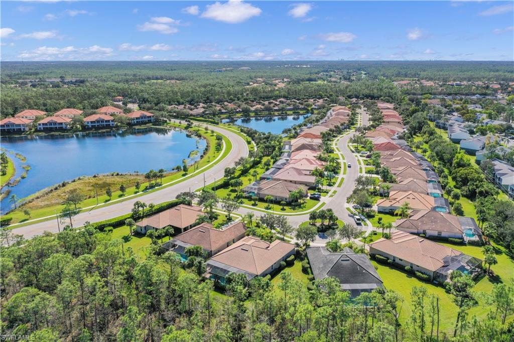 7950 Founders Circle Naples, FL 34104 - Photo 2 of 43 an aerial view of residential houses with outdoor space and river