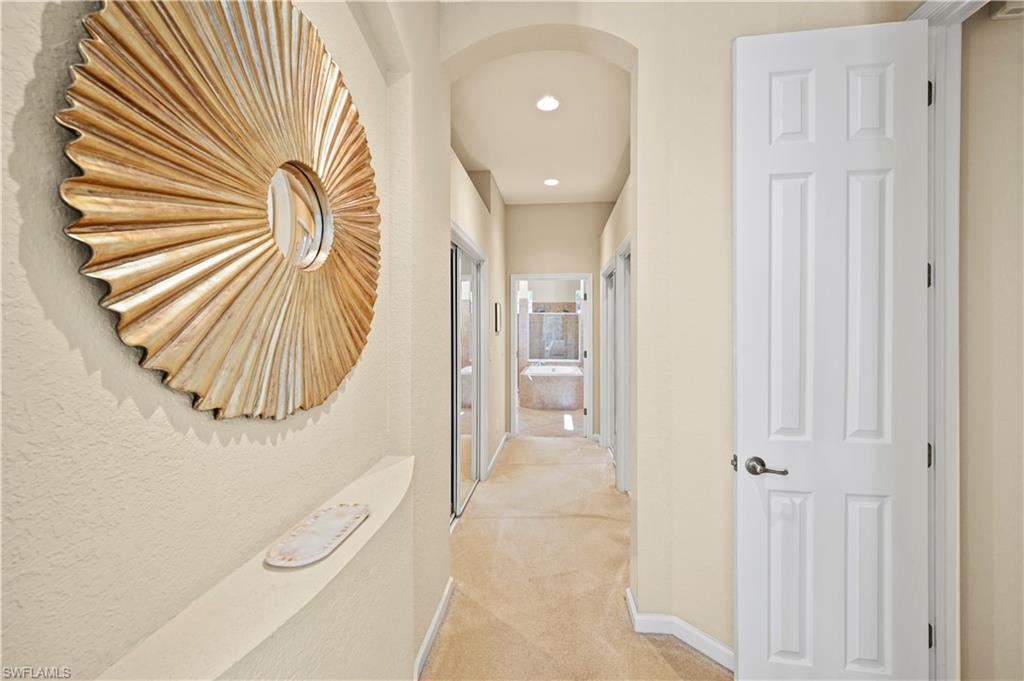 7950 Founders Circle Naples, FL 34104 - Photo 24 of 43 a bathroom with a sink and a mirror