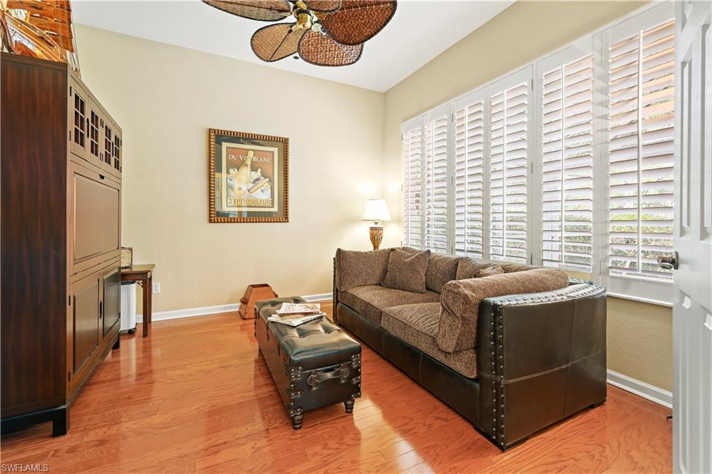 7950 Founders Circle Naples, FL 34104 - Photo 27 of 43 a living room with furniture and a window