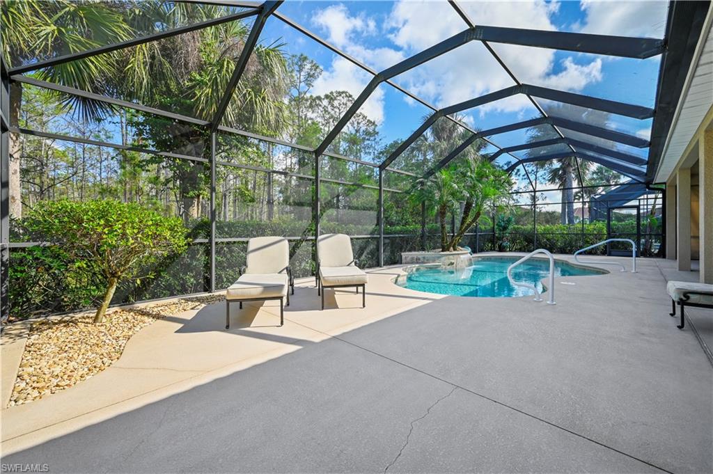 7950 Founders Circle Naples, FL 34104 - Photo 35 of 43 a view of backyard with swimming pool and sitting area