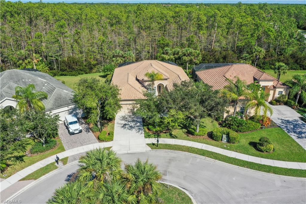 7950 Founders Circle Naples, FL 34104 - Photo 42 of 43 an aerial view of a house with a yard and garden