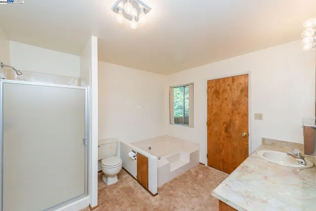 a room with a bed and a window