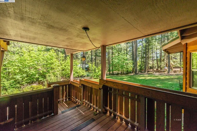 a view of a balcony with wooden floor