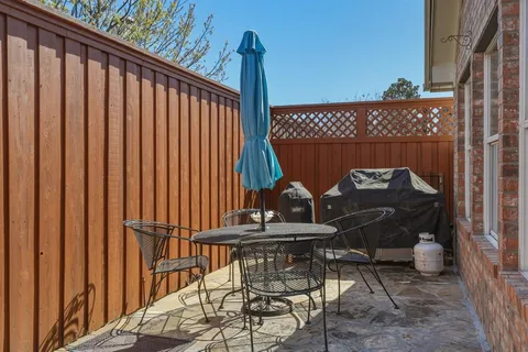 a view of balcony with wooden floor