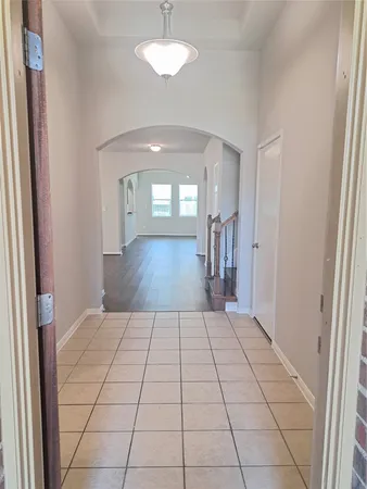 wooden floor in a hall with a window
