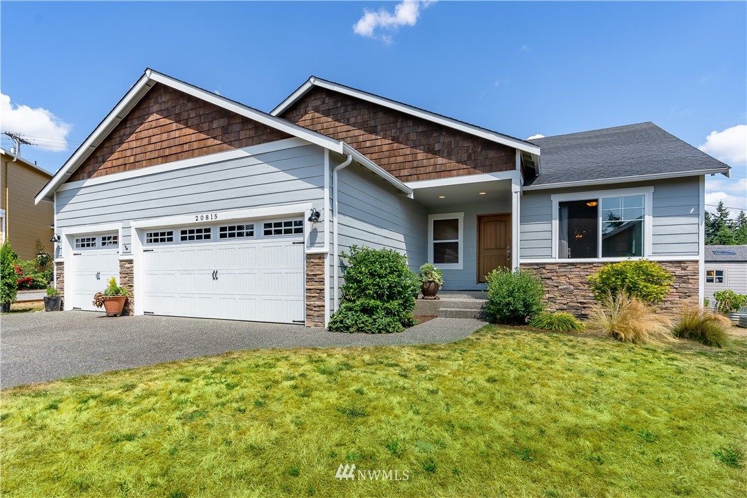 20815 9th Drive Southeast Bothell, WA 98021 - Photo 1 of 23 a front view of a house with a yard