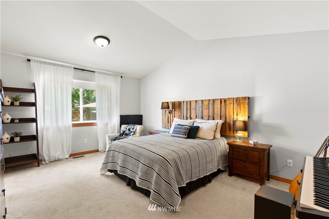 20815 9th Drive Southeast Bothell, WA 98021 - Photo 12 of 23 a bedroom with a bed and a window