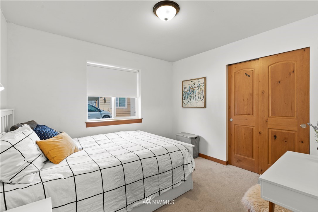 20815 9th Drive Southeast Bothell, WA 98021 - Photo 15 of 23 a bedroom with a bed and painting on the wall