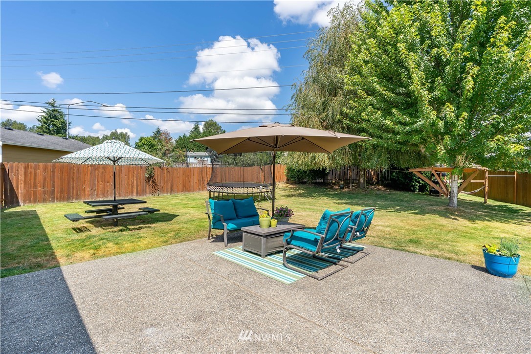 20815 9th Drive Southeast Bothell, WA 98021 - Photo 19 of 23 a view of backyard with swimming pool and furniture