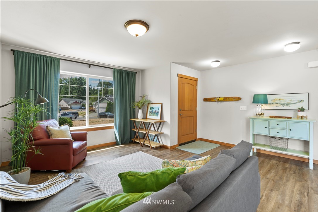 20815 9th Drive Southeast Bothell, WA 98021 - Photo 3 of 23 a living room with furniture and a large window