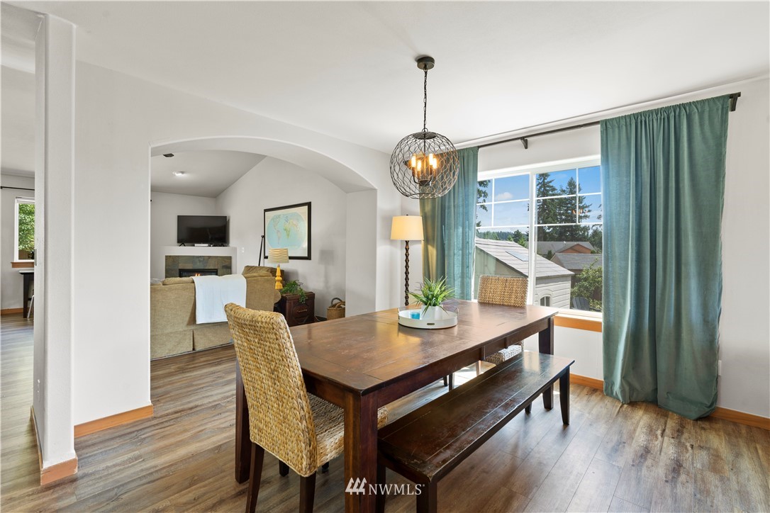 20815 9th Drive Southeast Bothell, WA 98021 - Photo 7 of 23 a view of a dining room with furniture window and wooden floor