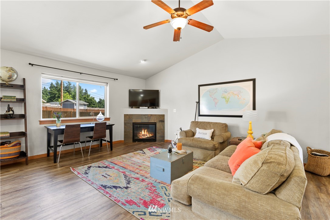 20815 9th Drive Southeast Bothell, WA 98021 - Photo 8 of 23 a living room with furniture and a fireplace
