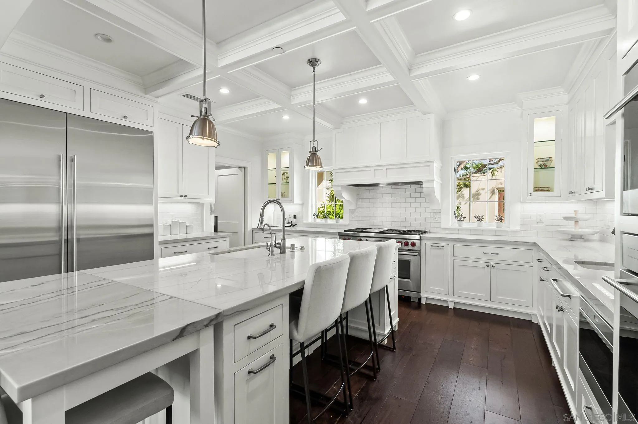 5930 Rutgers Road La Jolla, CA 92037 - Photo 12 of 43 a kitchen with white cabinets and appliances