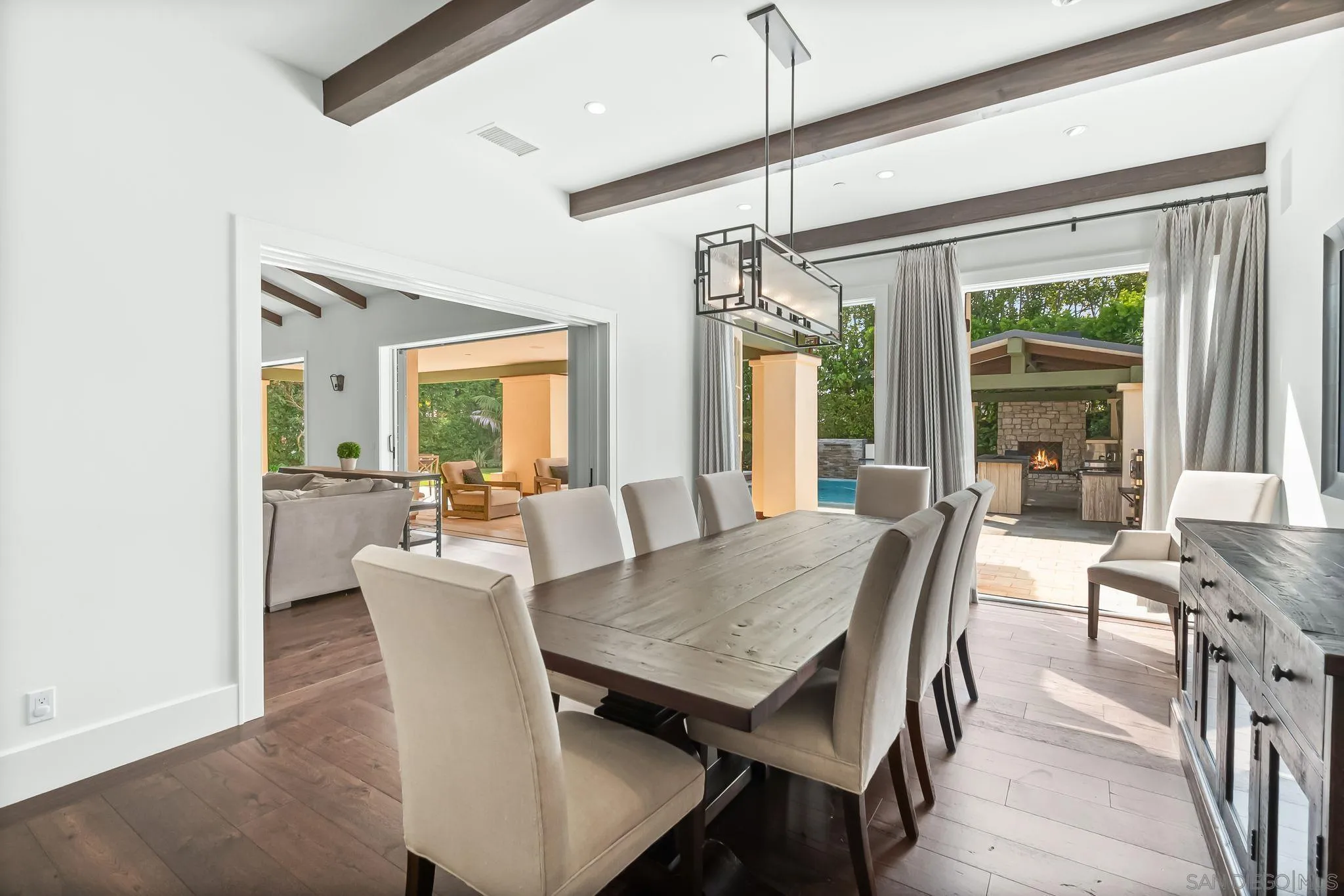 5930 Rutgers Road La Jolla, CA 92037 - Photo 14 of 43 a view of a dining room with furniture window and wooden floor