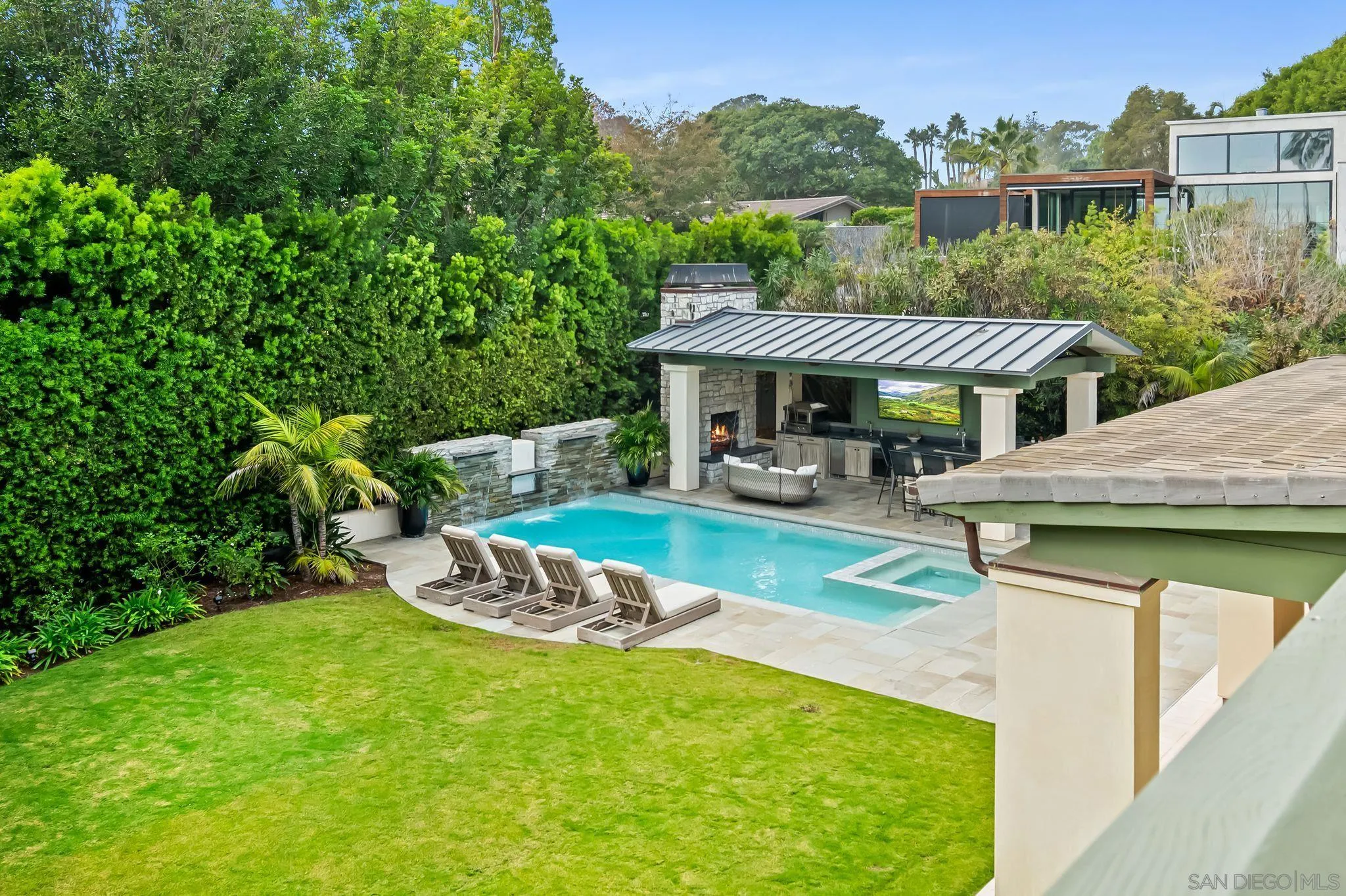 5930 Rutgers Road La Jolla, CA 92037 - Photo 28 of 43 a front view of a house with a yard table and chairs