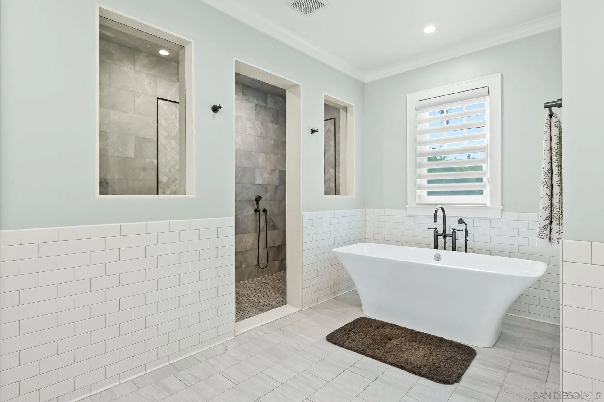 5930 Rutgers Road La Jolla, CA 92037 - Photo 30 of 43 a bathroom with a sink a toilet a mirror and shower