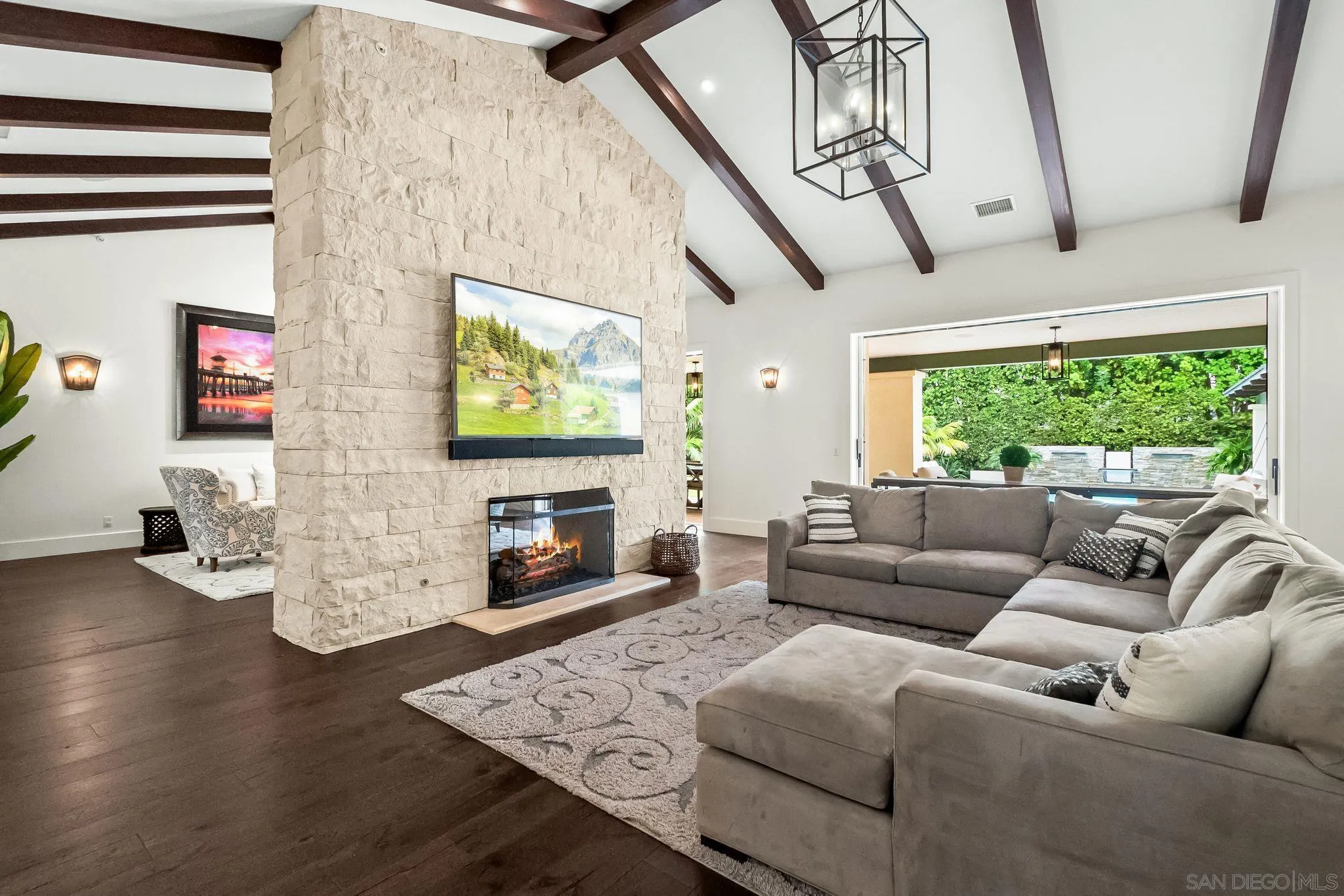 5930 Rutgers Road La Jolla, CA 92037 - Photo 3 of 43 a living room with fireplace furniture and a flat screen tv
