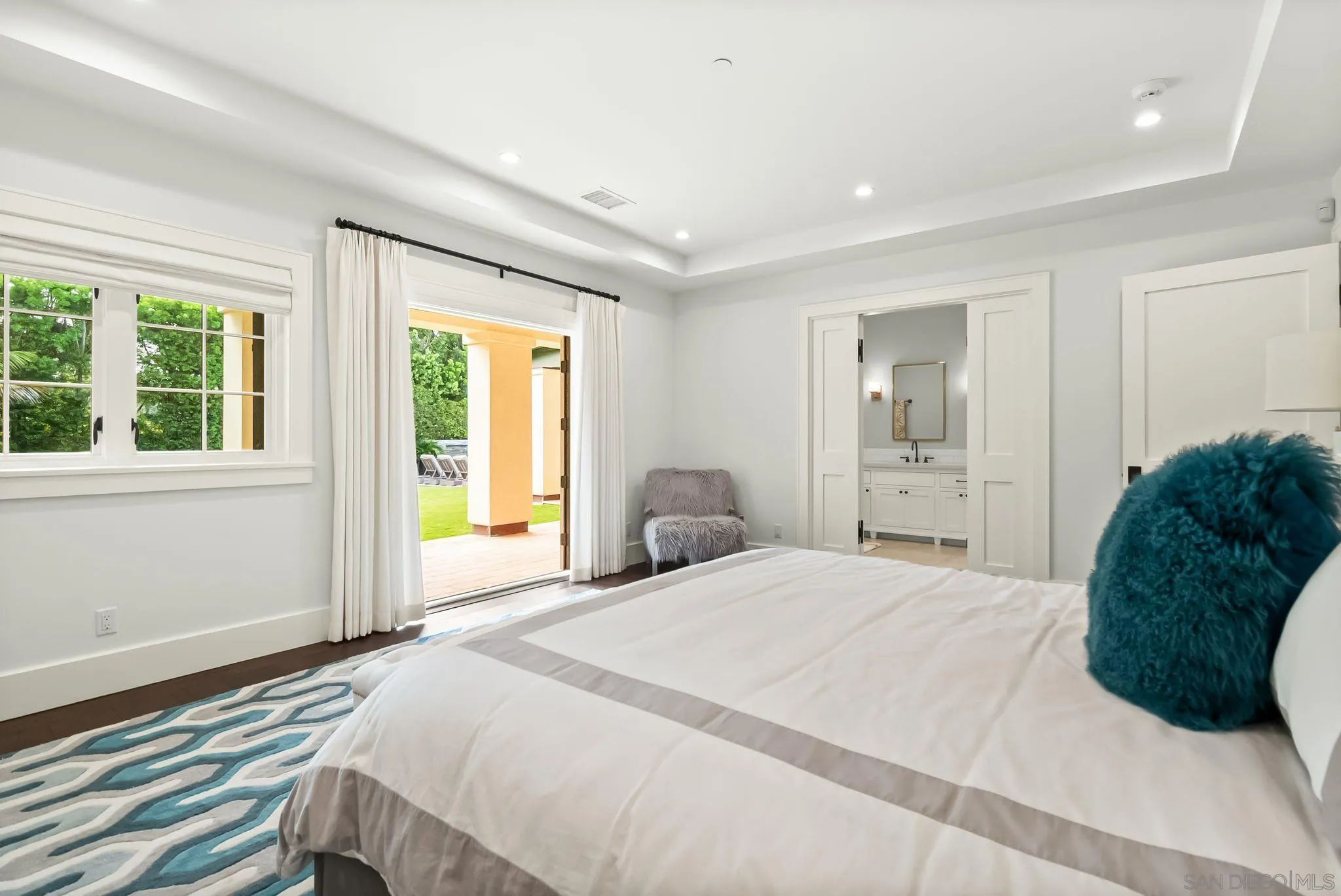 5930 Rutgers Road La Jolla, CA 92037 - Photo 33 of 43 a bedroom with a bed window and a mirror