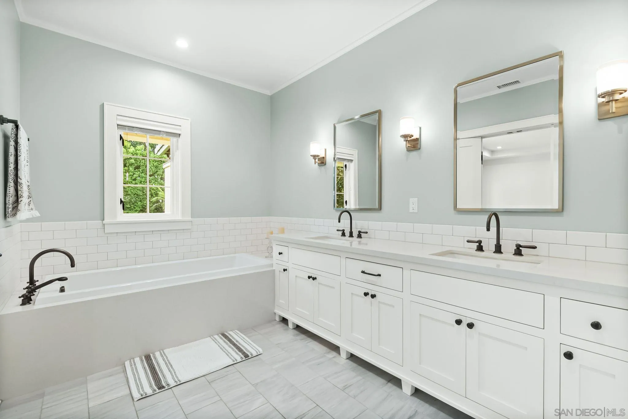 5930 Rutgers Road La Jolla, CA 92037 - Photo 34 of 43 a spacious bathroom with a double vanity sink mirror and bathtub