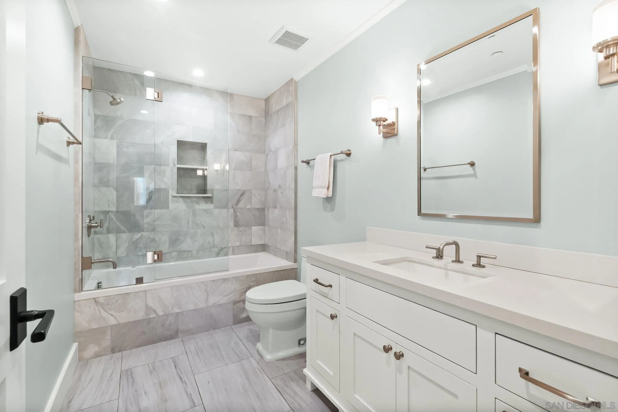 5930 Rutgers Road La Jolla, CA 92037 - Photo 40 of 43 a bathroom with a bathtub shower sink mirror and toilet