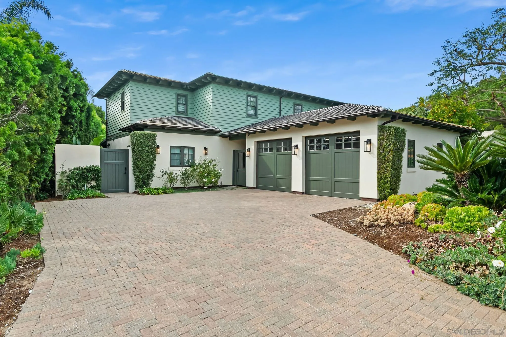 5930 Rutgers Road La Jolla, CA 92037 - Photo 4 of 43 a front view of a house with a garden and plants