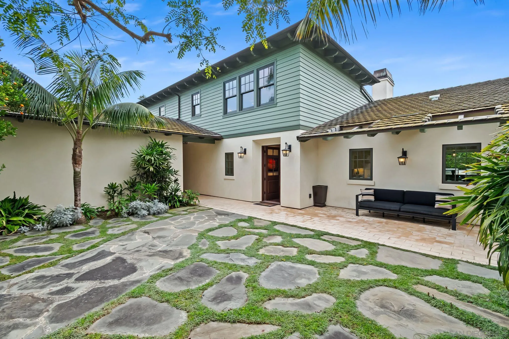 5930 Rutgers Road La Jolla, CA 92037 - Photo 6 of 43 a front view of house with yard outdoor seating and covered with plants