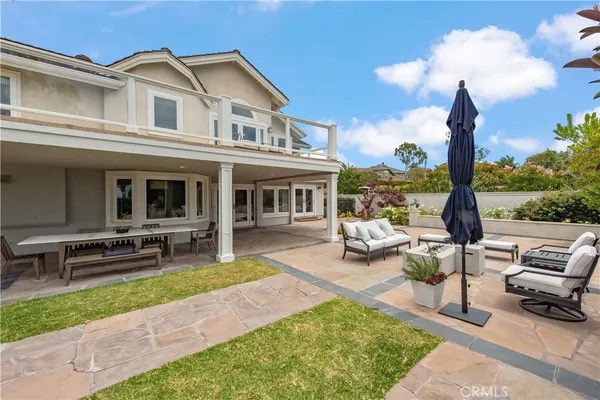 a view of a backyard with sitting area