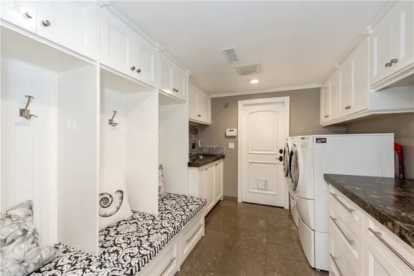 a kitchen with stainless steel appliances a stove a sink and a refrigerator