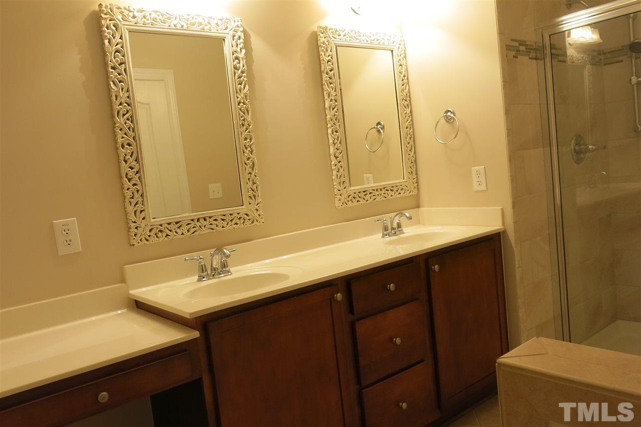 1016 Palace Garden Way Raleigh, NC 27603 - Photo 13 of 22 Master bath features dual vanity and updated mirrors