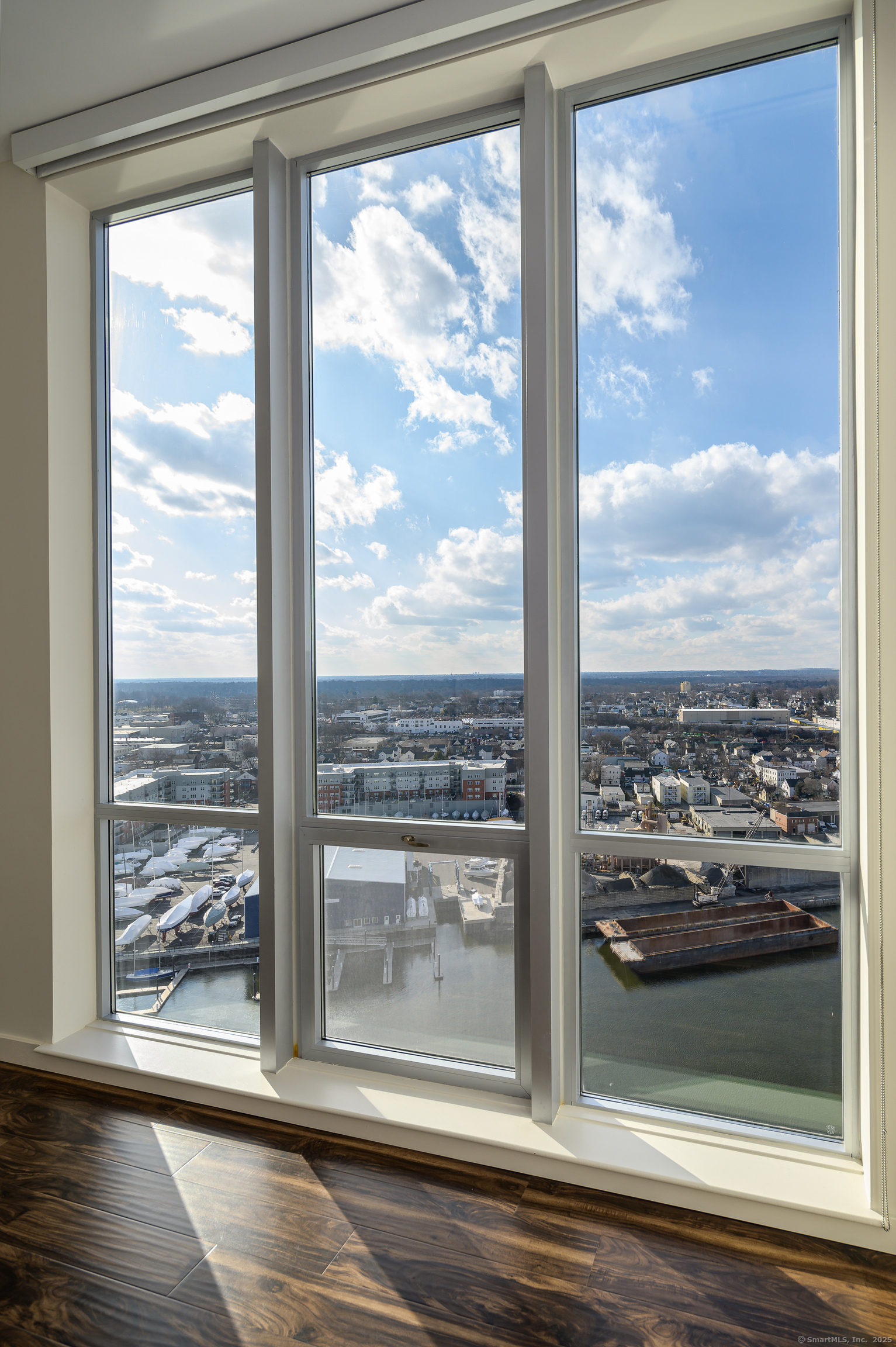 1 Harbor Point Road, Unit 1 Stamford, CT 06902 - Photo 12 of 23 a view of a glass door of the house