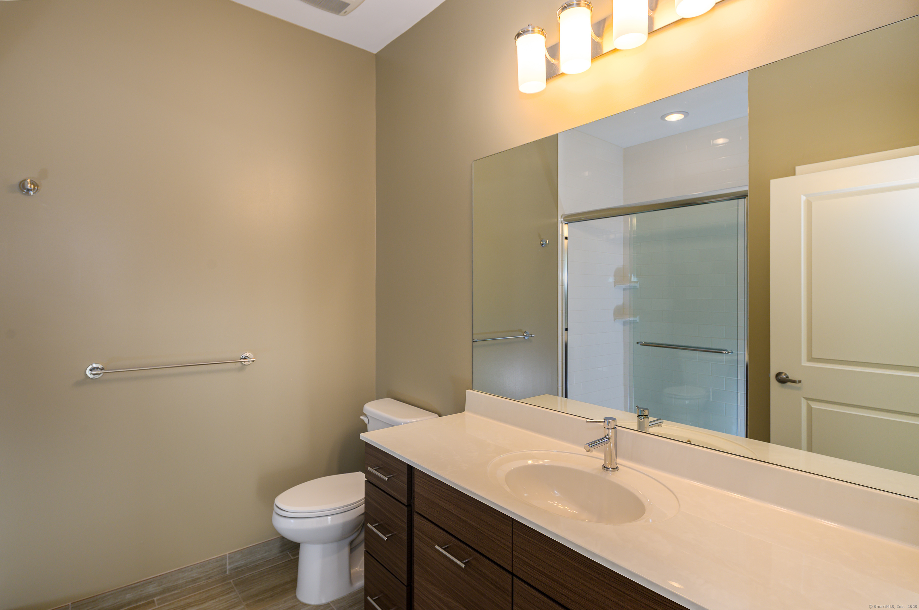 1 Harbor Point Road, Unit 1 Stamford, CT 06902 - Photo 16 of 23 a bathroom with a sink toilet and shower