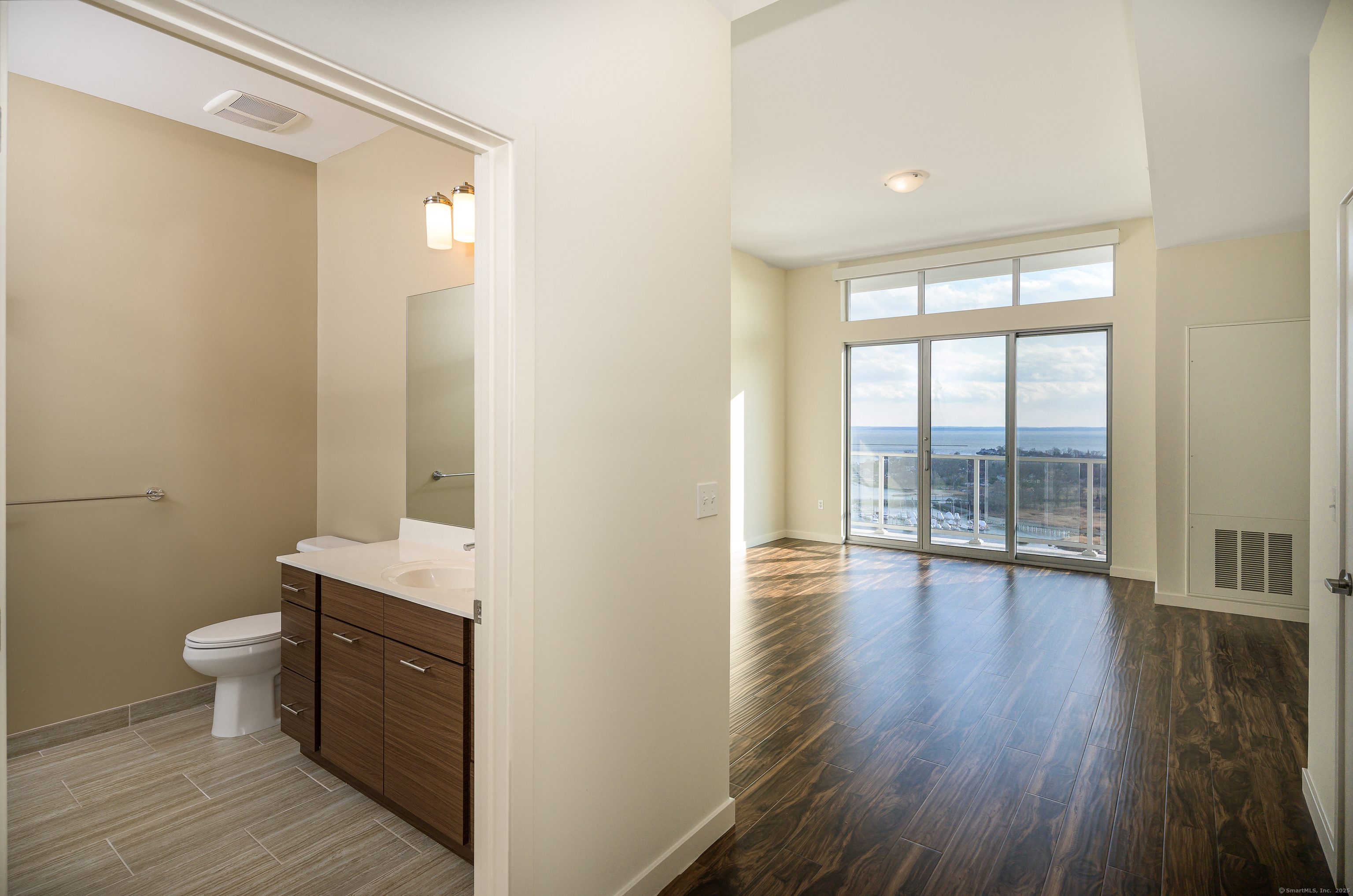 1 Harbor Point Road, Unit 1 Stamford, CT 06902 - Photo 17 of 23 a view of bathroom with a sink toilet and window