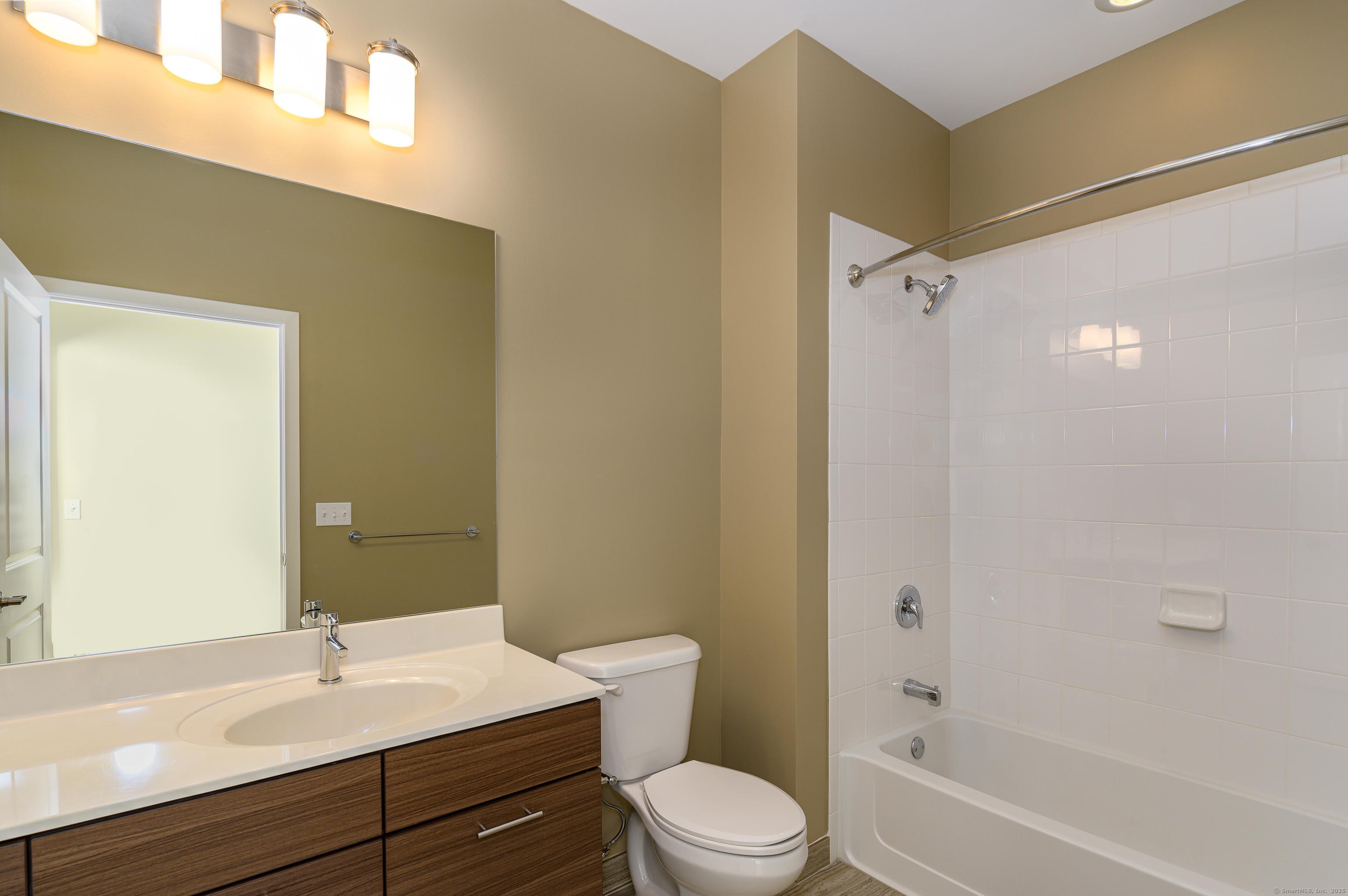 1 Harbor Point Road, Unit 1 Stamford, CT 06902 - Photo 18 of 23 a bathroom with a sink a toilet and shower