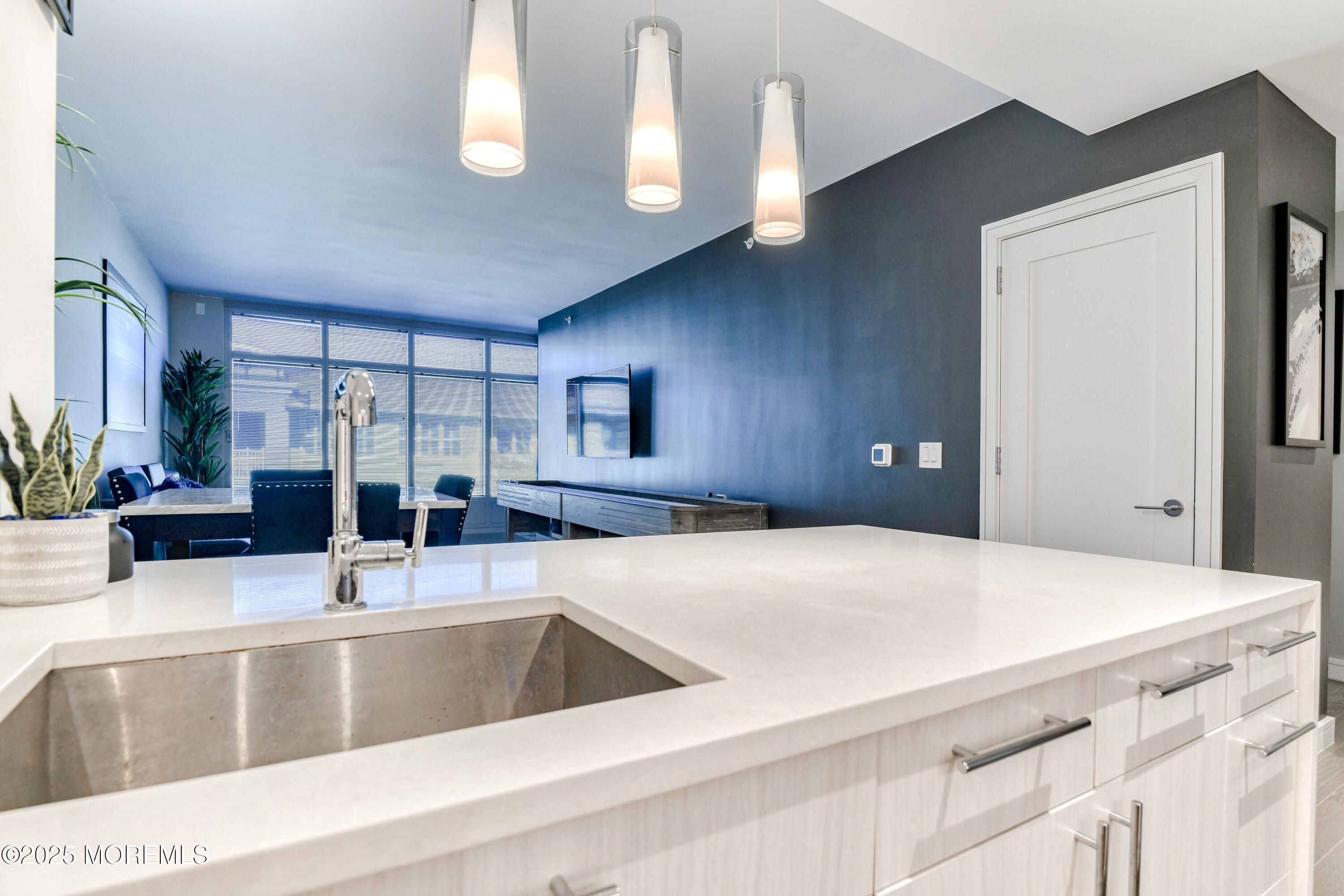 30 Melrose Terrace, Unit 303 Long Branch, NJ 07740 - Photo 11 of 54 a kitchen with a sink and white cabinets