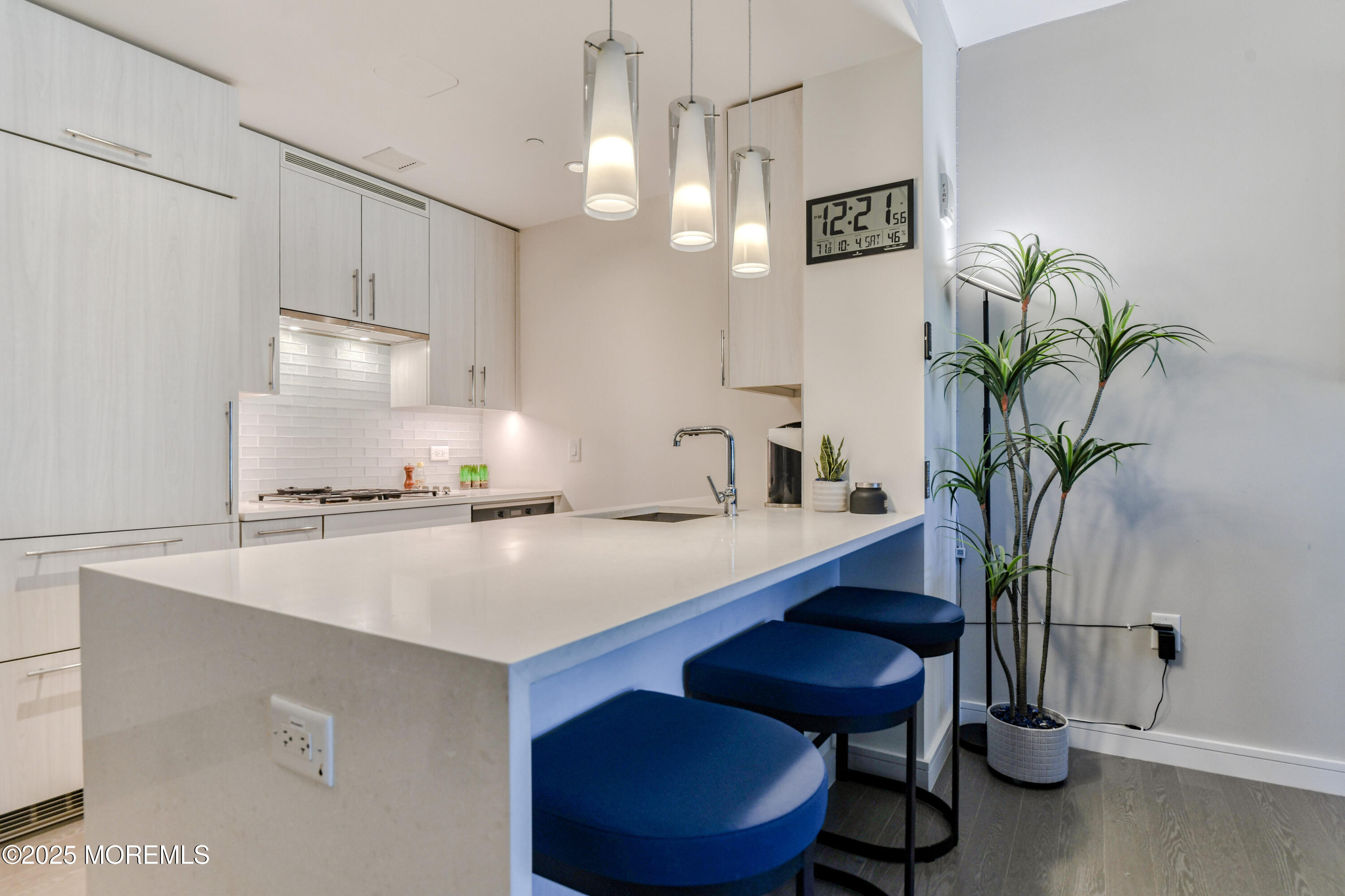 30 Melrose Terrace, Unit 303 Long Branch, NJ 07740 - Photo 12 of 54 a view of a kitchen with a table and chairs
