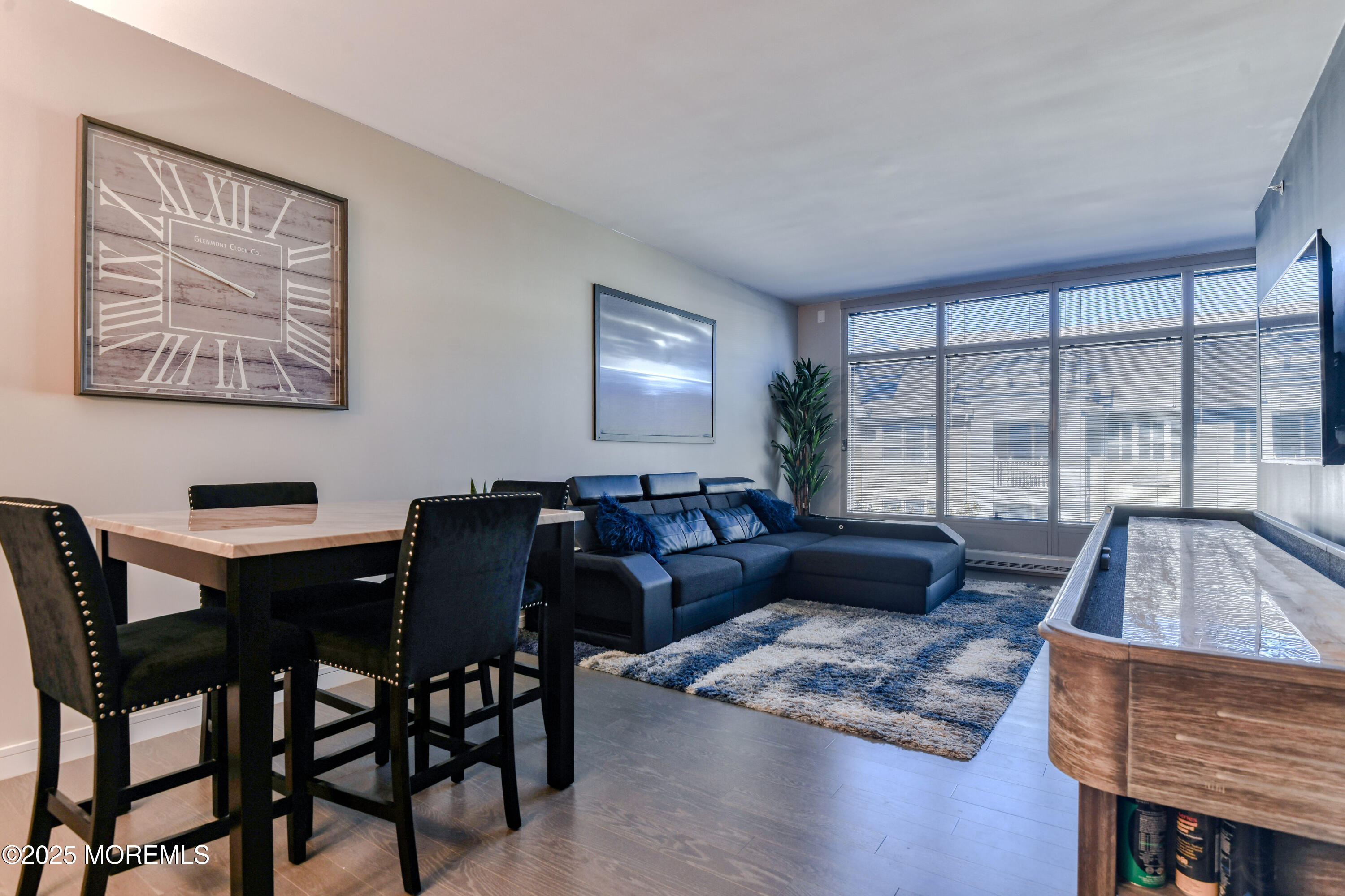 30 Melrose Terrace, Unit 303 Long Branch, NJ 07740 - Photo 14 of 54 a living room with furniture and a large window