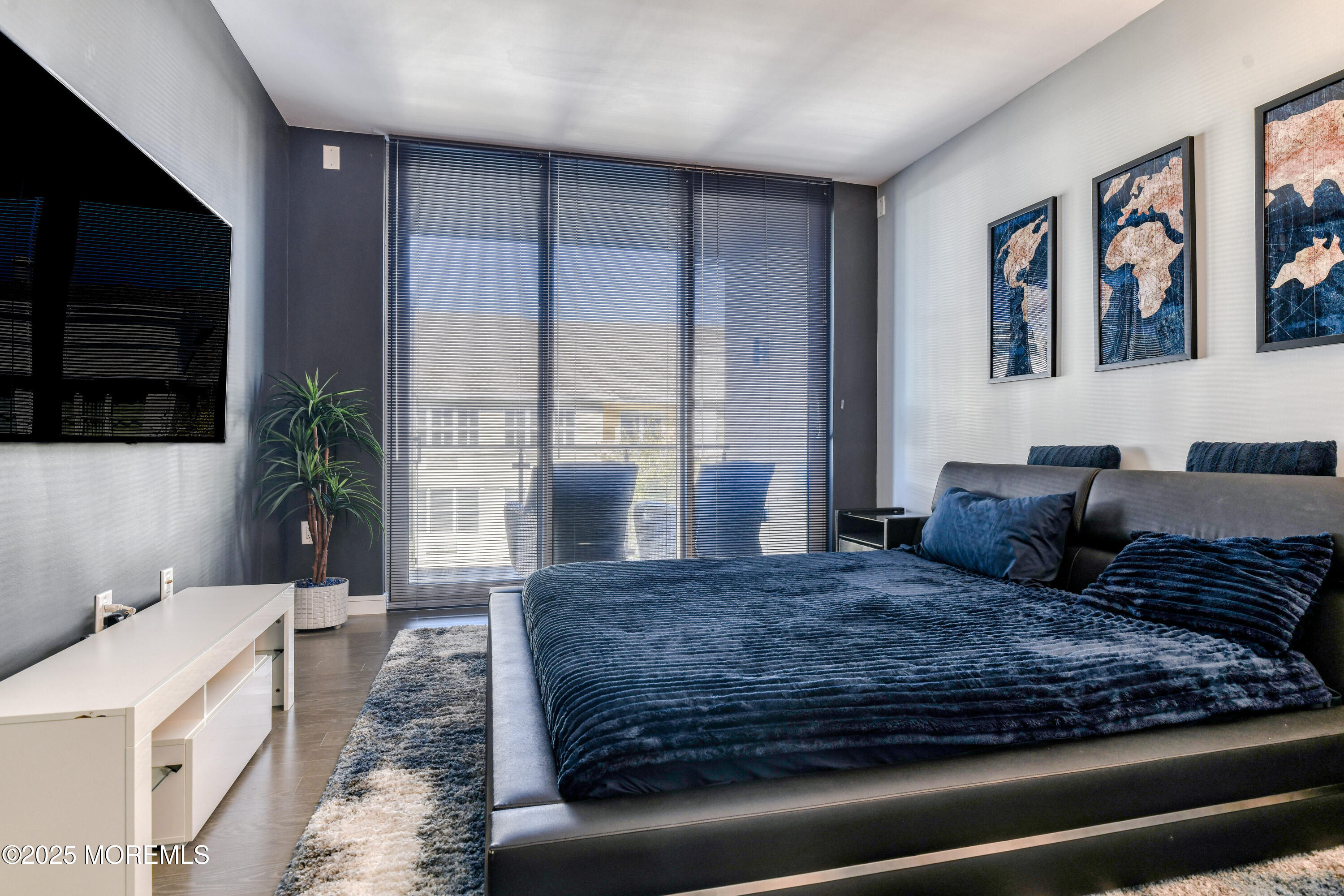 30 Melrose Terrace, Unit 303 Long Branch, NJ 07740 - Photo 18 of 54 a large bedroom with a large bed a rug and potted plant