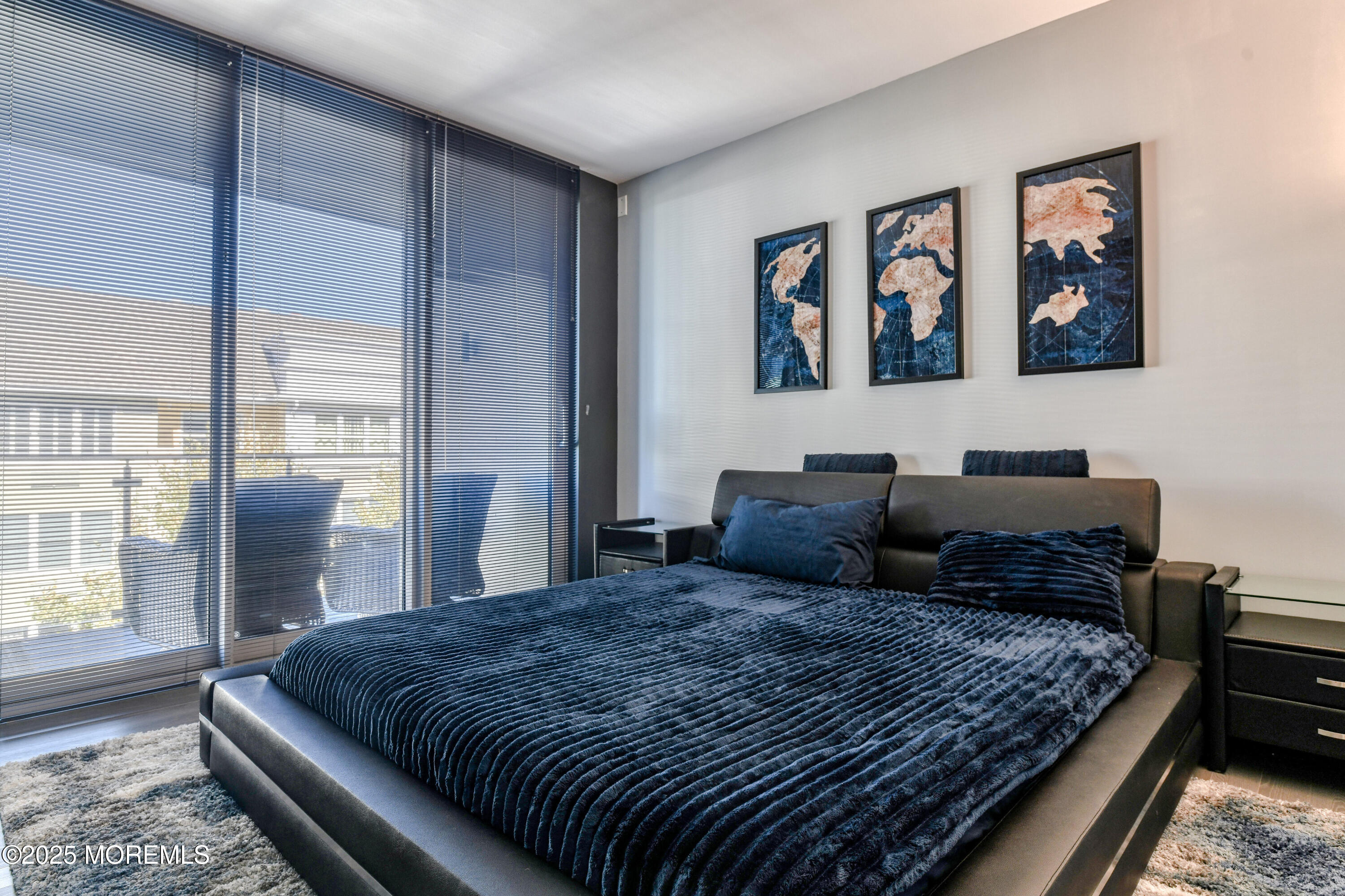 30 Melrose Terrace, Unit 303 Long Branch, NJ 07740 - Photo 19 of 54 a bedroom with a large bed and a window