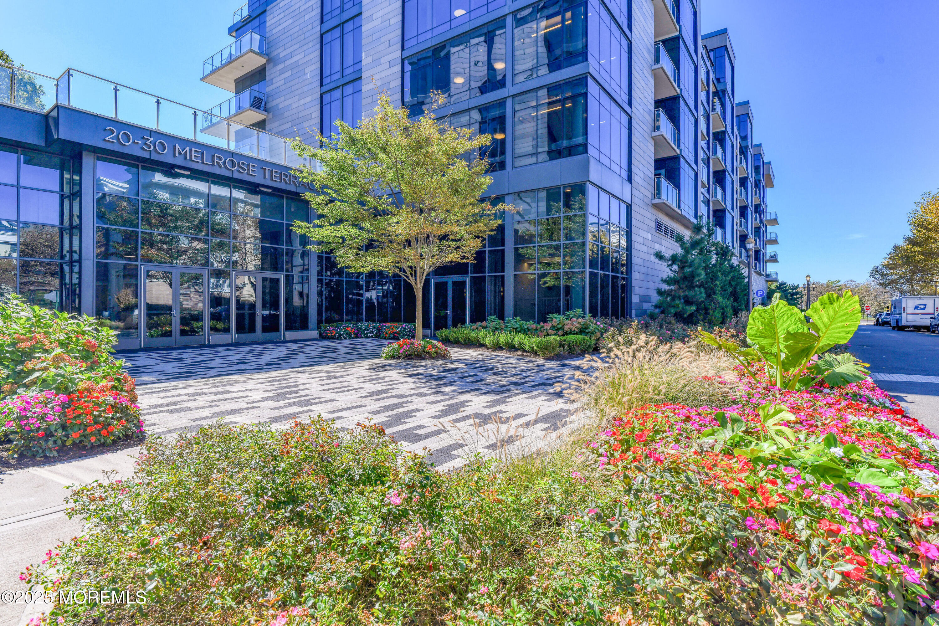 30 Melrose Terrace, Unit 303 Long Branch, NJ 07740 - Photo 2 of 54 a view of a chairs and table in a backyard