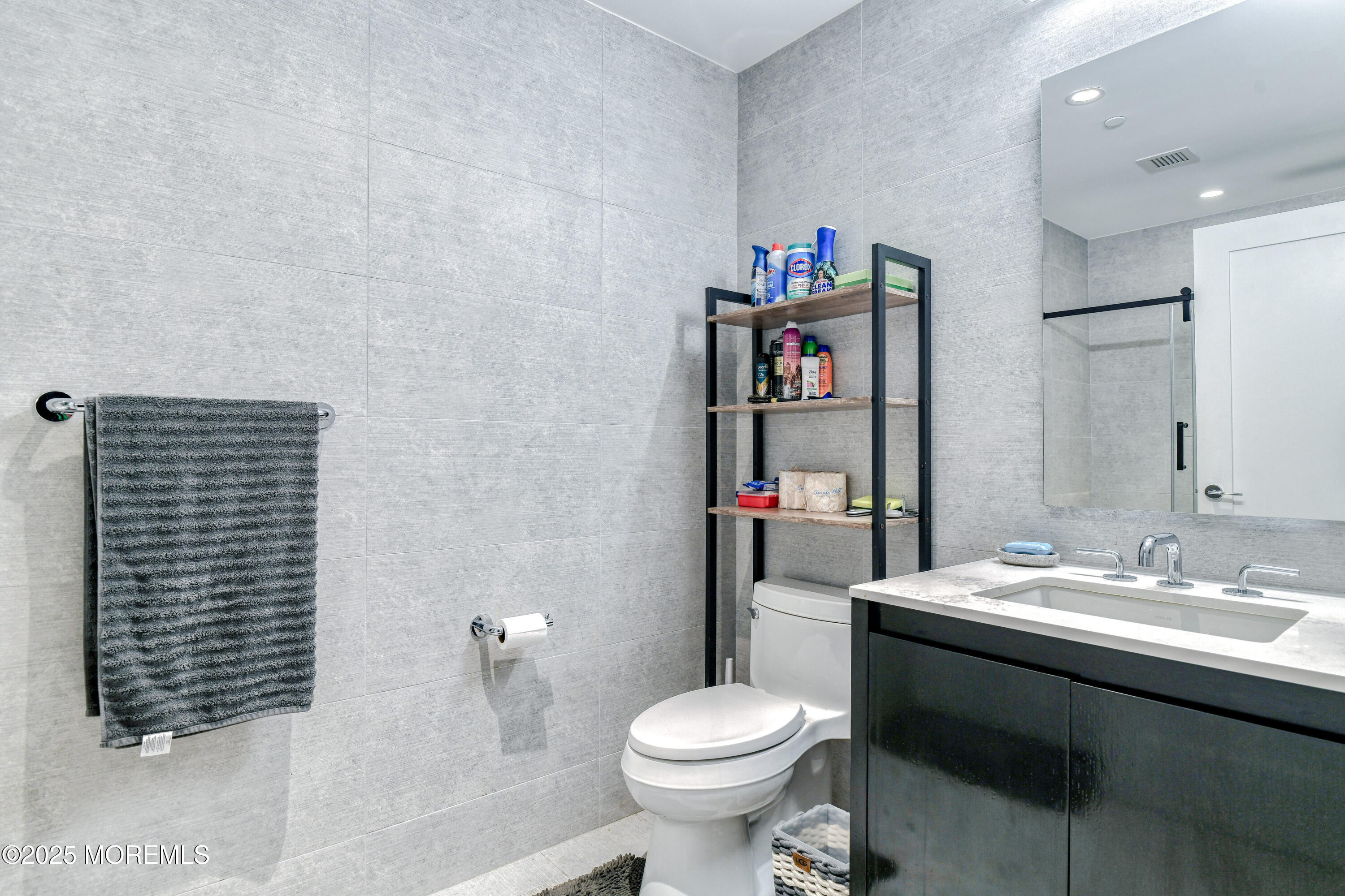 30 Melrose Terrace, Unit 303 Long Branch, NJ 07740 - Photo 22 of 54 a bathroom with a sink toilet and a shower